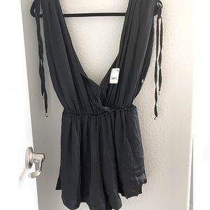 Black free people romper. Low cut, I got sent two and both of them didn’t fit.